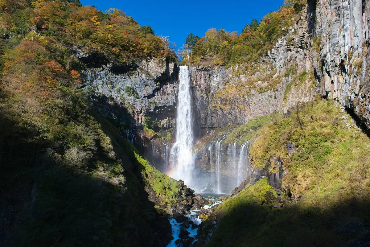 Kegon Falls below wooded cliffs in Nikko